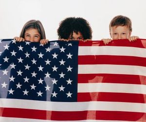 kids behind flag
